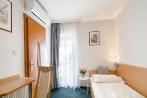 Posteľ alebo postele v izbe v ubytovaní Alfréd Panzió