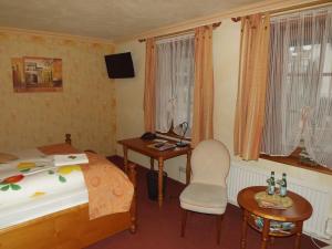 Ένα ή περισσότερα κρεβάτια σε δωμάτιο στο Hotel Piccolo