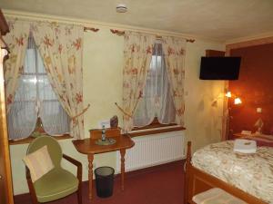 Ένα ή περισσότερα κρεβάτια σε δωμάτιο στο Hotel Piccolo