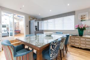 a dining room with a table and chairs at Suites at number Ten in Broadstairs