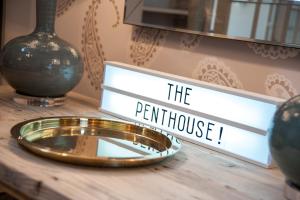 a sign that reads the perth house on a table at Suites at number Ten in Broadstairs