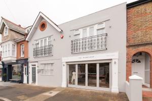 a white building with a store front at Suites at number Ten in Broadstairs