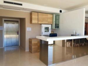 a kitchen with a counter top and a microwave at Bara Bay in Metajna