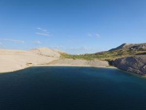 an aerial view of a large body of water at Bara Bay in Metajna