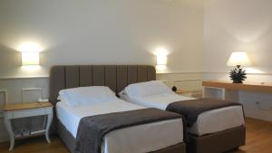Postel nebo postele na pokoji v ubytování Hotel Marechiaro
