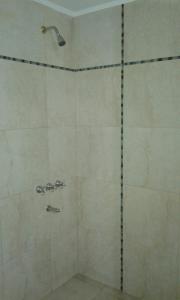 a shower with a glass door in a bathroom at Casa Picoco in San Bernardo +26 photos