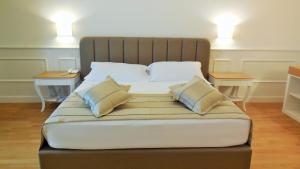 Postel nebo postele na pokoji v ubytování Hotel Marechiaro