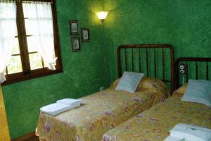 Ένα ή περισσότερα κρεβάτια σε δωμάτιο στο Casa Rural Eucaliptus