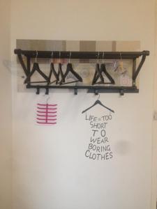 a shelf with shoes and a sign on a wall at Alcaiceria in Granada