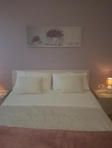 Ένα ή περισσότερα κρεβάτια σε δωμάτιο στο Iris Appartamenti