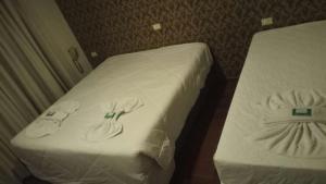Posteľ alebo postele v izbe v ubytovaní Pissoloto Hotel