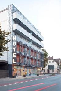 a building with a sign that reads hotel at Hotel Buntrock in Holzminden