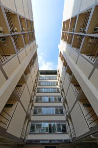 a view from the bottom of two tall buildings at Studio Residence Sukhumvit 71 in Bangkok +23 photos
