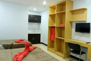 TV a/nebo společenská místnost v ubytování Global 88 Apartelle + 17 fotografií