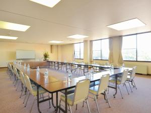 a large conference room with a long table and chairs at Hotel Wellness Notoji in Hakui