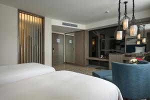 Postel nebo postele na pokoji v ubytování Paradise Suites Hotel