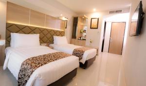 Katil atau katil-katil dalam bilik di Hotel Daily Inn