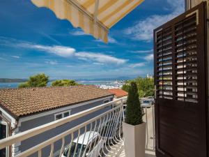 a balcony with a view of a building at Apartments LATINO in Crikvenica