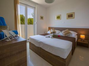En eller flere senge i et værelse på Apartments Villa Grande + 134 billeder