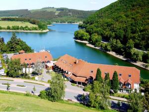 an aerial view of a resort with a lake at Göbel's Seehotel Diemelsee in Diemelsee
