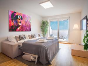 Posteľ alebo postele v izbe v ubytovaní SKY9 Penthouse Apartments