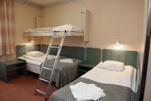 Postel nebo postele na pokoji v ubytování Hotell Älvdalen