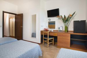 Letto o letti in una camera di Hotel Oasis
