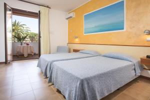 Letto o letti in una camera di Hotel Oasis
