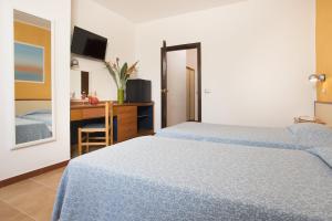 Letto o letti in una camera di Hotel Oasis
