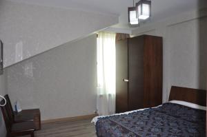 Ένα ή περισσότερα κρεβάτια σε δωμάτιο στο Anna Apartaments on Didveli