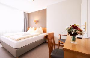 Postel nebo postele na pokoji v ubytování Hotel Alter Wirt