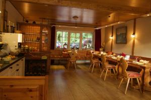 a kitchen and dining room with a table and chairs at Haus Sonneck in Schluchsee