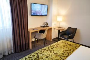 TV a/nebo společenská místnost v ubytování Amrâth Hotel Lapershoek Arenapark