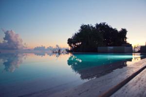 a view of a body of water at sunset at Vallegrande Nature Resort by Geocharme in Cefalù