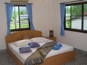 Postel nebo postele na pokoji v ubytování D&K Smiley Phuket Resort + 25 fotografií