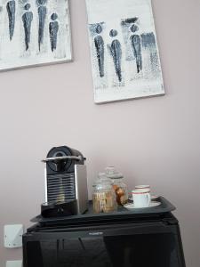 a black table with a coffee maker on top of it at Séjour Pic Saint Loup in Saint-Mathieu-de-Tréviers