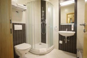 Koupelna v ubytování Hotel Calypso