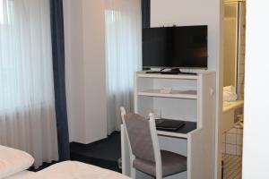 TV a/nebo společenská místnost v ubytování Hotel Windthorst