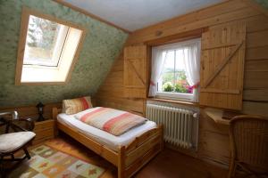 Un pat sau paturi într-o cameră la Haus Sonneck