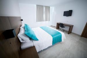 Postel nebo postele na pokoji v ubytování Aquamarina Hotel