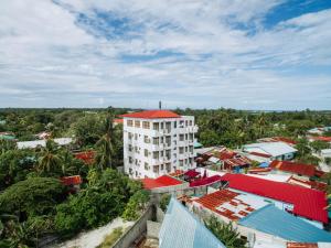 an aerial view of a building in a city at Rekidhiye Inn in Hithadhoo