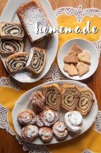 two plates with different types of bread on a table at B&B Na Kluk in Idrija