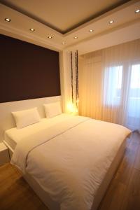 Postel nebo postele na pokoji v ubytování Super Luxury Apartments