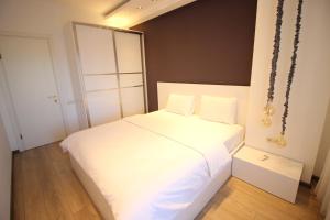 Postel nebo postele na pokoji v ubytování Super Luxury Apartments