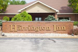 a brick sign in front of a building at Harrington Inn in Fremont