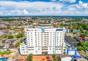 an overhead view of a white building in a city at GHL Hotel Grand Villavicencio in Villavicencio