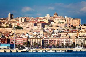 a view of a city from the water at Vela Rooms in Cagliari