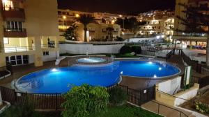 an overhead view of a swimming pool at night at Oliva Home in Los Cristianos +13 photos