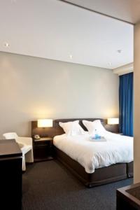 Postel nebo postele na pokoji v ubytování Blue Woods Hotel - Deerlijk