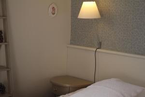 Postel nebo postele na pokoji v ubytování Chambre d'Hôtes de L'Abricotier